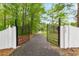 Gated entrance to a long driveway, leading to the home at 3109 Country Lake Dr, Powder Springs, GA 30127