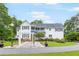 Charming home with a manicured lawn, walkway and mature trees at 3109 Country Lake Dr, Powder Springs, GA 30127