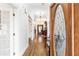 Elegant foyer with gleaming hardwood floors and a stunning stained glass front door at 3109 Country Lake Dr, Powder Springs, GA 30127