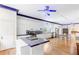 Spacious kitchen with stainless steel appliances, white cabinets, hardwood floors, and a functional kitchen island at 3109 Country Lake Dr, Powder Springs, GA 30127