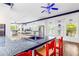 Eat-in kitchen featuring custom cabinetry, granite countertops, and a breakfast bar with seating at 3109 Country Lake Dr, Powder Springs, GA 30127