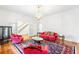 Living room with chandelier, fireplace, and hardwood floors at 3109 Country Lake Dr, Powder Springs, GA 30127