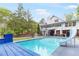 Backyard with in-ground pool, diving board and slide near the home at 3109 Country Lake Dr, Powder Springs, GA 30127