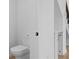 Modern powder room featuring a toilet and under stair storage space at 90 Cleveland Unit B Se St, Atlanta, GA 30316