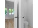 Bright bathroom featuring toilet and view of an adjacent room with natural light at 90 Cleveland Unit B Se St, Atlanta, GA 30316