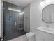 Modern bathroom features a glass enclosed shower, sleek fixtures, and oval mirror at 90 Cleveland Unit B Se St, Atlanta, GA 30316