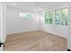 Bright bedroom featuring wood floors, ceiling fan, and windows at 90 Cleveland Unit B Se St, Atlanta, GA 30316