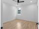 Minimalist bedroom with hardwood floors, fan and neutral walls at 90 Cleveland Unit B Se St, Atlanta, GA 30316