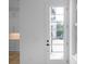 Bright entryway with a multi-pane glass door, white trim, and partial view of the kitchen and hardwood floors at 90 Cleveland Unit B Se St, Atlanta, GA 30316