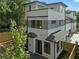 Stunning exterior elevation showcasing a modern, three-story home with white and gray siding and black-framed windows at 90 Cleveland Unit B Se St, Atlanta, GA 30316