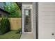 Close-up of the front door, featuring a sleek design, clear glass panes, and a small, well-maintained front yard at 90 Cleveland Unit B Se St, Atlanta, GA 30316