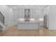 Gourmet kitchen features stainless appliances, an island, and custom white cabinetry at 90 Cleveland Unit B Se St, Atlanta, GA 30316