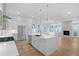 Open concept kitchen with an island, stainless steel appliances, and a view of the living room at 90 Cleveland Unit B Se St, Atlanta, GA 30316