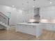 Modern kitchen with an island, stainless steel appliances, and white cabinets at 90 Cleveland Unit B Se St, Atlanta, GA 30316