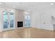 Modern living room features a fireplace and French doors leading to a backyard patio at 90 Cleveland Unit B Se St, Atlanta, GA 30316