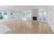 Bright living room with hardwood floors, a modern fireplace, recessed lighting, and sliding glass doors to the backyard at 90 Cleveland Unit B Se St, Atlanta, GA 30316