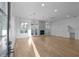 Spacious living room with wood floors, fireplace, recessed lighting, and glass doors to the backyard at 90 Cleveland Unit B Se St, Atlanta, GA 30316