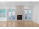 Bright living room features a fireplace and French doors to the outside at 90 Cleveland Unit B Se St, Atlanta, GA 30316