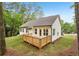 Beautiful back yard exterior view featuring a deck and a well maintained lawn at 2279 Lakeview Pkwy, Villa Rica, GA 30180