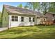 Spacious backyard featuring a wood deck and lush green lawn, perfect for outdoor entertaining at 2279 Lakeview Pkwy, Villa Rica, GA 30180