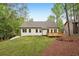 Lush green backyard and wooden deck offer a serene outdoor living space at 2279 Lakeview Pkwy, Villa Rica, GA 30180