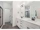 Bathroom featuring double vanity sinks, marble countertops, and a glass-door shower at 2279 Lakeview Pkwy, Villa Rica, GA 30180