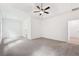 Large bedroom with ceiling fan and tray ceilings at 2279 Lakeview Pkwy, Villa Rica, GA 30180