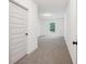 Bright bedroom features fresh paint, new carpeting, and a window with a wooded view at 2279 Lakeview Pkwy, Villa Rica, GA 30180