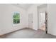Bedroom with neutral carpet and view of the surrounding neighborhood outside of the window at 2279 Lakeview Pkwy, Villa Rica, GA 30180