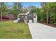 A modern two-story home with a well-manicured lawn and a two-car garage at 2279 Lakeview Pkwy, Villa Rica, GA 30180