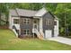 Two-story house with a stone facade, white siding and a two-car garage at 2279 Lakeview Pkwy, Villa Rica, GA 30180