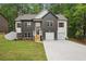 Two-story home boasts a two-car garage, attractive curb appeal, and well-maintained landscaping at 2279 Lakeview Pkwy, Villa Rica, GA 30180