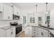 Kitchen featuring white cabinets, stainless steel appliances, granite countertops, and hardwood floors at 2279 Lakeview Pkwy, Villa Rica, GA 30180