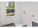 Clean laundry room with a window for natural light at 2279 Lakeview Pkwy, Villa Rica, GA 30180