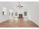 Spacious living room featuring a stone fireplace, vaulted ceiling, and natural light from large windows at 2279 Lakeview Pkwy, Villa Rica, GA 30180