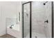 Main bathroom featuring a tub and large glass shower at 2279 Lakeview Pkwy, Villa Rica, GA 30180