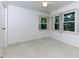 Bright bedroom with multiple windows and shutters at 301 Lakemoore Ne Dr # B, Atlanta, GA 30342