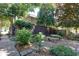 Outdoor seating area with stone benches and table with lovely garden and landscaping at 301 Lakemoore Ne Dr # B, Atlanta, GA 30342