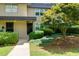 A ground-level shot of a building with a meticulously kept lawn and tidy hedge at 301 Lakemoore Ne Dr # B, Atlanta, GA 30342