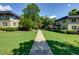 Well-manicured lawn area with trees and greenery located between the building facades at 301 Lakemoore Ne Dr # B, Atlanta, GA 30342