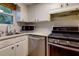 Updated kitchen with stainless steel appliances and white subway tile backsplash at 301 Lakemoore Ne Dr # B, Atlanta, GA 30342