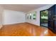 A naturally lit living room featuring wooden floors and an exit door at 301 Lakemoore Ne Dr # B, Atlanta, GA 30342