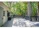Back deck with ample seating overlooking a lush yard at 3710 Lavilla Dr, Powder Springs, GA 30127