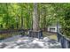 Back deck with ample seating overlooking a lush yard and a detached garage at 3710 Lavilla Dr, Powder Springs, GA 30127