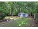 Detached garage with ample space for parking or storage in back yard at 3710 Lavilla Dr, Powder Springs, GA 30127