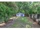Detached garage with ample space for parking or storage in back yard at 3710 Lavilla Dr, Powder Springs, GA 30127