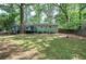 Spacious backyard with lush lawn and deck at 3710 Lavilla Dr, Powder Springs, GA 30127