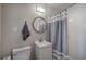 Bathroom featuring white subway tile and a round mirror at 3710 Lavilla Dr, Powder Springs, GA 30127