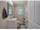 Bathroom featuring a grey-framed mirror, a white vanity, and a shower with a patterned curtain at 3710 Lavilla Dr, Powder Springs, GA 30127