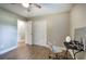 Bedroom featuring wood-style floors, neutral paint, a ceiling fan, and closet space at 3710 Lavilla Dr, Powder Springs, GA 30127